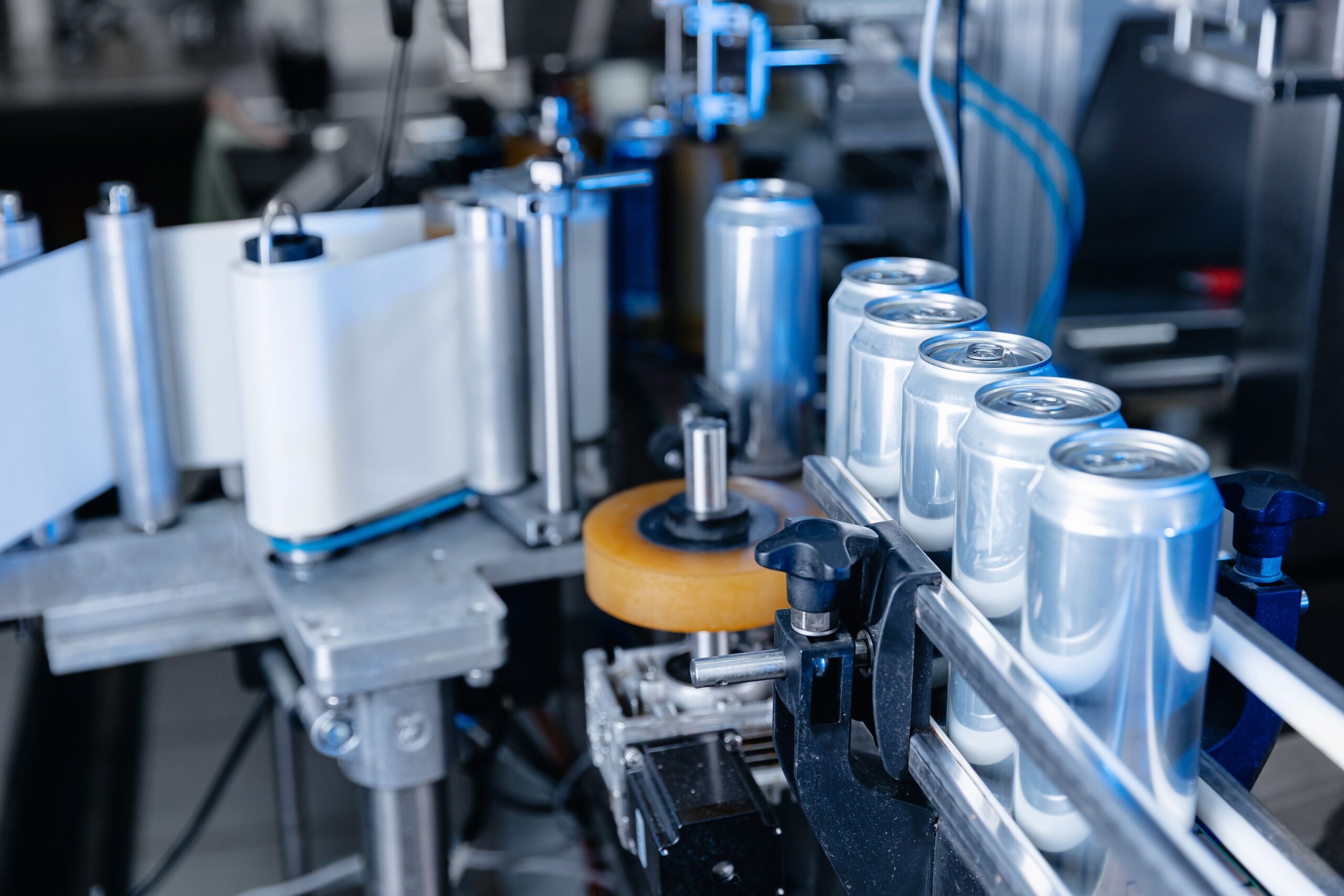 Automated,Beverage,Canning,Process,In,Modern,Beer,Factory,,Blue,Light.